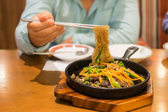 Korean food, carrot and cellophane stir fried Japchae serve on f