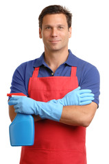 Smiling male man janitor maid house husband in red apron with blue spray bottle disinfectant isolated on white background