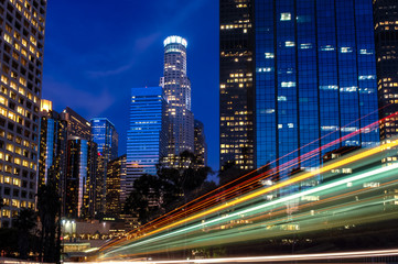 Deep blue twilight Los Angeles Skyline with dynamic diagonal red green yellow light streaks racing through