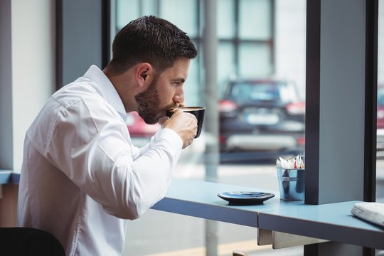 Businessman having a cup of coffee