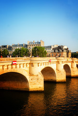 Obraz premium Pont Neuf and SEine river at sunny summer day, Paris, France toned