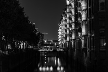 Fototapeta na wymiar Hamburg Warehouse district (Speicherstadt) at night in black and white