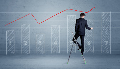Man drawing chart from ladder