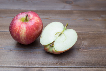 Red fresh apples on the wooden table