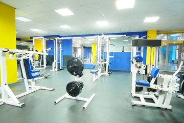 Interior of a fitness hall with wights and other sport equipment