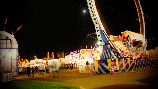 A time lapse of people at the fair.