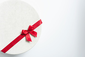 Round White Gift Boxes With Red Ribbon