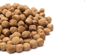 A pile of dog food isolated on a white background