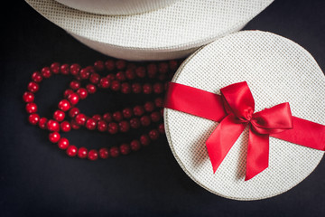White Round Gift Boxes with Red Ribbon and Red Neckless 