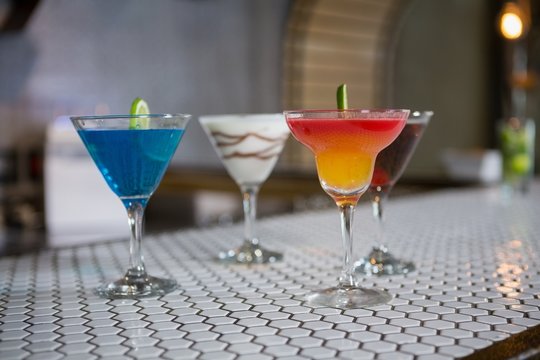 Various cocktails drinks on a bar counter