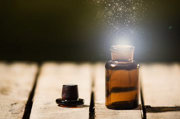 Small brown medicine bottle for magicians remedy, animated star dust coming out from top ,sitting...