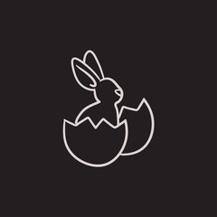 Easter bunny sitting in egg shell sketch icon.