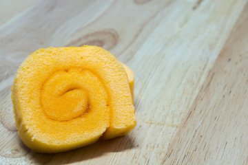 Obraz na płótnie Canvas orange jam roll cake