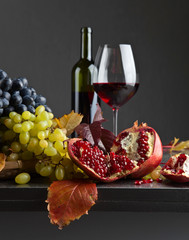 Ripe juicy grape and glass of red wine