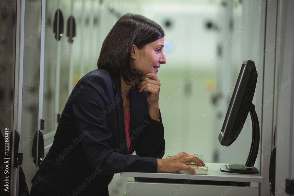 Aufkleber Technician working on personal computer while analyzing server