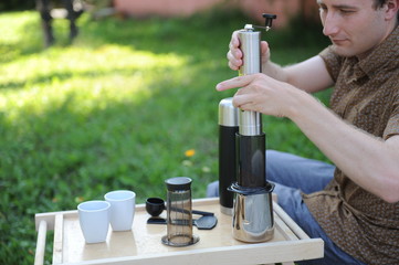 Man making coffee in nature