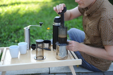 Man making coffee in nature