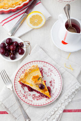 Slice of cherry pie with ice cream