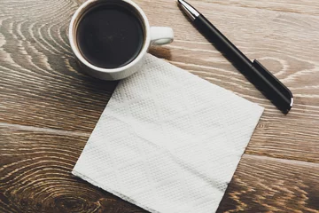 Selbstklebende Fototapeten coffee with napkin © ARAMYAN