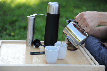 Man making coffee in nature