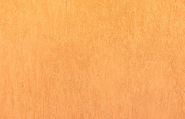 Orange decorative plaster texture.