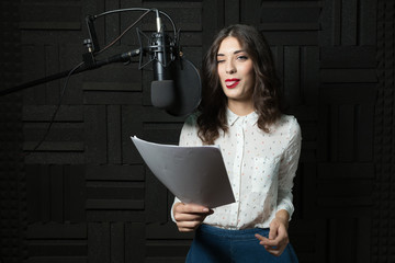 Funny young woman in recording station