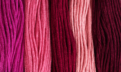 Redish mouline thread texture background - macro, close-up