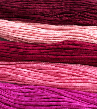 Redish mouline thread texture background - macro, close-up