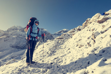 Happy trekker resting on her ascend.