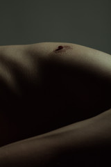 Fototapeta premium Art photography concept. Body parts of young handsome man - chest