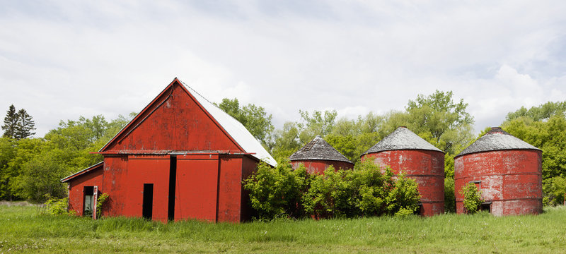 Old red barn with red silos,Manitoba canada