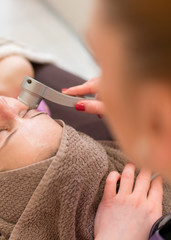 Laser treatment to remove facial skin imperfections.