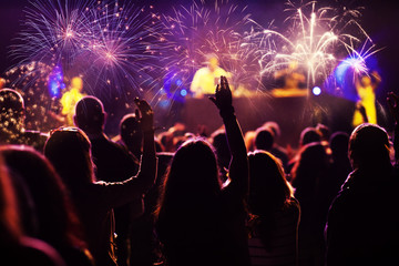 Fototapeta na wymiar New Year concept - cheering crowd and fireworks