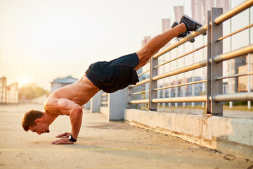 Sport men doing push-ups during outdoor cross training workout