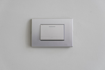 light switch on white wall for construction design concept