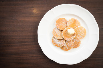 Fototapeta na wymiar Pancake with butter on top