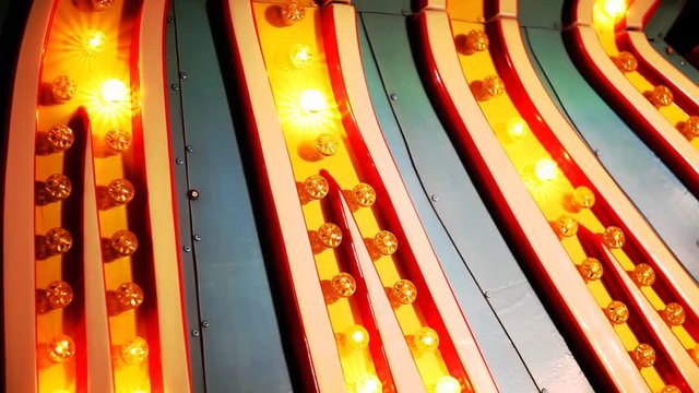 Bright lights from a sign animate.