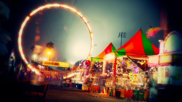 An abstract time lapse the midway at a fair.