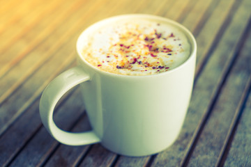 Latte Coffee art on the wooden table ( Filtered image processed