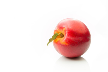 Nectarine on its side on a white background