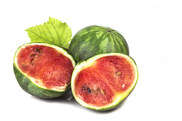 halved small decorative ripe juicy watermelon with a whole