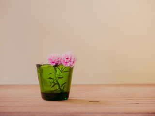 Flower in green vintage glass