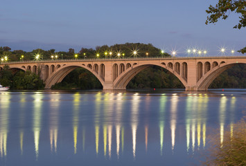 Key Bridge at sunrise in Washington Dc, USA. Bridge over Potomac River with reflections at dusk.
