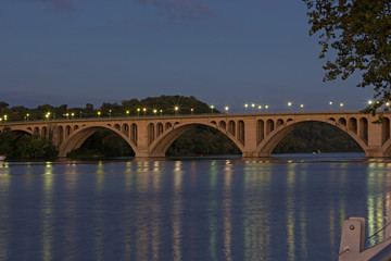 Night scene of Key Bridge in Washington DC, USA. Bridge with reflections at dusk.