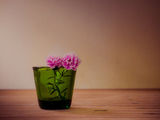 Flower in green vintage glass