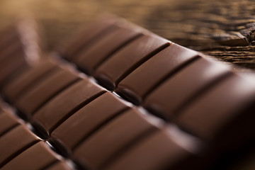 Bars Chocolate , candy sweet, dessert food on wooden background