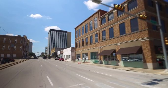 WACO, TX - Circa September, 2016 - A driving perspective past various businesses in downtown Waco, Texas.  	