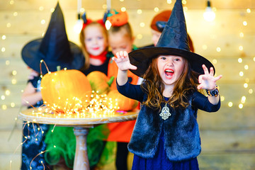 Happy group witch children during Halloween party