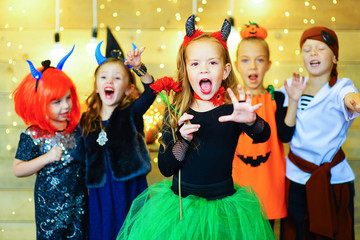 Happy group of children during Halloween party
