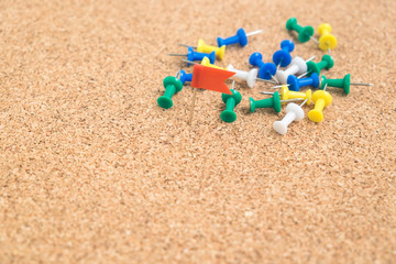 Colorful pins flag on wooden board